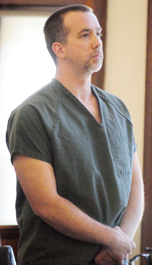 Robert MacMaster stands and listens to his sentence on Friday morning in Kennebec County Superior Court in Augusta. He was sentenced to four years, all but one-and-a-half years suspended, after being convicted by a jury of sexual abuse of a minor.