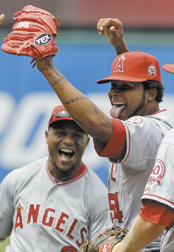 NO-HITTER: Los Angeles Angels starting pitcher Ervin Santana, right, and shortstop Erick Aybar (2) celebrate after Santana pitched a no-hitter against the Cleveland Indians on Wednesday in Cleveland. Santana allowed an unearned run in the first inning and the Angels won 3-1.