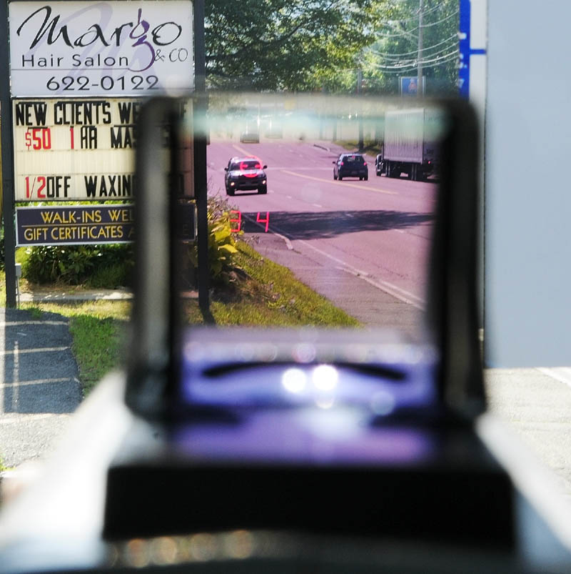 The viewfinder of the laser gun displays a cross hairs and the vehicles speed during a speeding enforcement detail Friday morning on Western Avenue in Augusta.