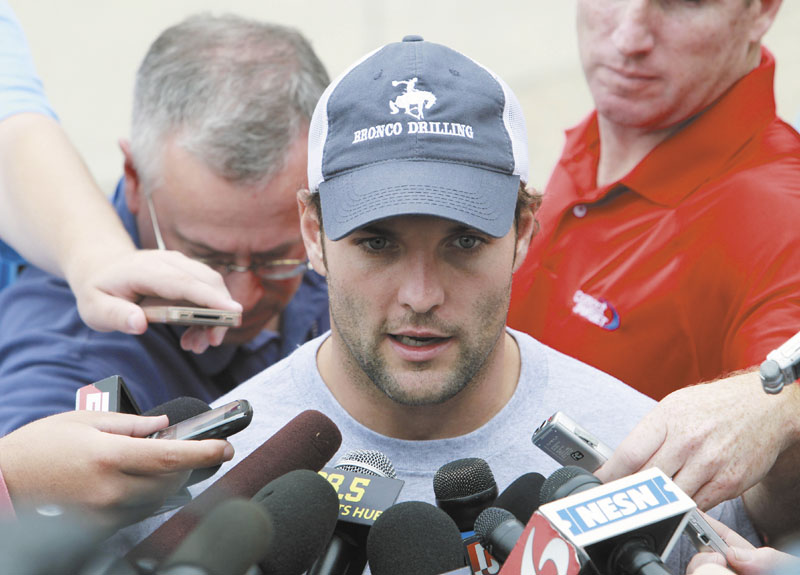 WELCOME BACK: New England Patriots’ wide receiver Wes Welker talks with reporters Tuesday at Gillette Stadium in Foxborough, Mass., a day after the NFL lockout ended.