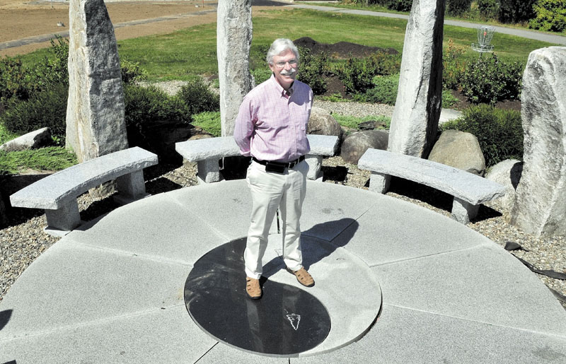 CLIMATOLOGY: Unity College President Stephen Mulkey stands outdoors at a rock garden on campus recently. Mulkey started his new job at the college last month.