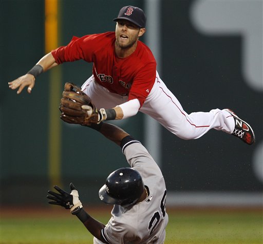 Boston Red Sox second baseman Dustin Pedroia, top, leaps over New York Yankees' Eduardo Nunez as he makes the force on a single by Derek Jeter in the third inning of a baseball game at Fenway Park in Boston, Friday, Aug. 5, 2011. (AP Photo/Charles Krupa)