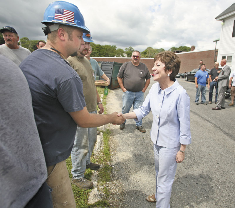 U.S. Sen. Susan Collins meets with employees from Bath Iron Works on Wednesday.