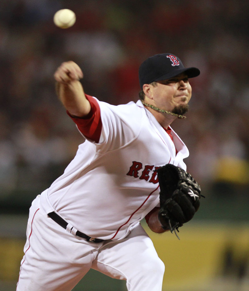 LONG, LONG NIGHT: Boston starting pitcher Josh Beckett delivers a pitch during the Red Sox 4 hour, 15 minute game against the New York Yankees on Sunday in Boston.
