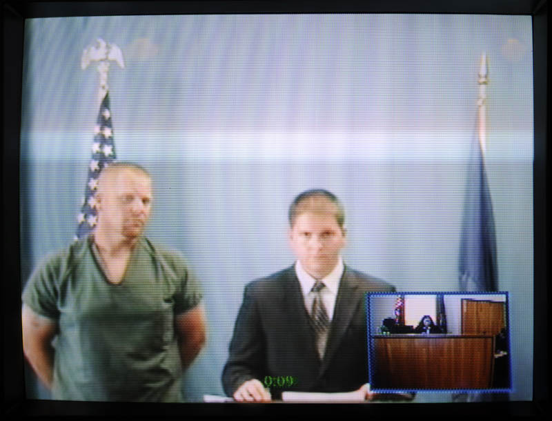IN COURT: James Bickford, left, appears in a video conference with his attorney, Tyler Smith, from the Kennebec County jail during an initial appearance at the Kennebec County Superior Court in Augusta on charges of robbery, gross sexual assault, burglary and assault from an incident that occurred Friday in China. Bickford, 33, is being held on $250,000 bail.