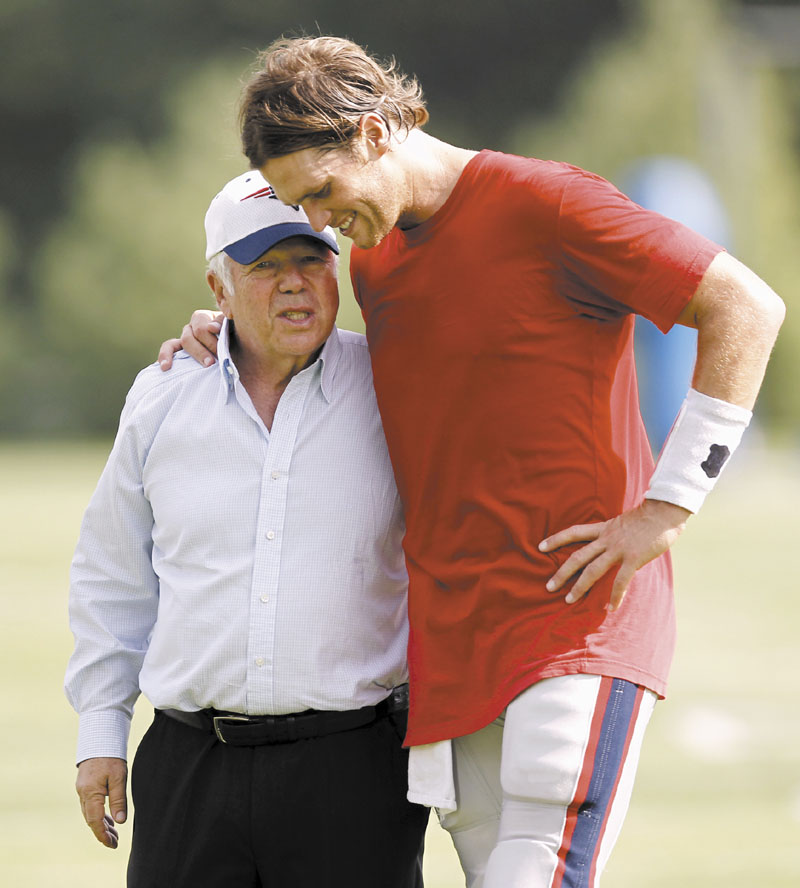 HOW YA DOING, BOSS? New England Patriots quarterback Tom Brady, right, talks with owner Robert Kraft during training camp on Aug. 2. Three weeks after his wife’s death, Kraft spoke to the media Wednesday a day before the team’s preseason opens against the Jacksonville Jaguars.