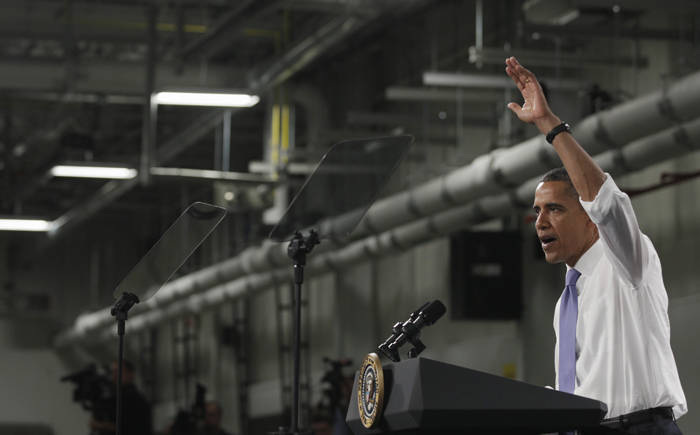President Barack Obama gestures while speaking at Johnson Controls Inc. in Holland, Mich., today.
