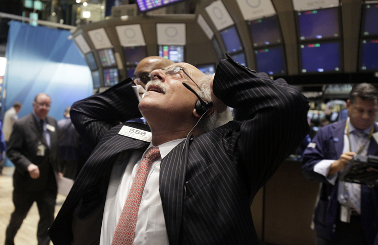 Trader Peter Tuchman reacts to the action on the floor of the New York Stock Exchange today.