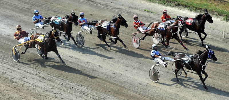 OUT IN FRONT: Kevin Switzer Jr., drives Western Comfort (5) to the lead at the halfway point of the Walter H. Hight Invitational on Saturday at the Skowhegan State Fair Saturday. Western Comfort held on to pick up the victory.