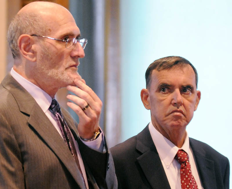 MAKING A MOTION: Rep. Frederick L. Wintle, R-Garland, right, listens to his attorney, Leonard Sharon, discuss the status of cases against him for criminal threatening with a dangerous weapon and carrying a concealed weapon Tuesday during a Kennebec County Superior Court hearing in Augusta. Wintle is accused of pulling a loaded handgun on a stranger in a Waterville Dunkin’ Donuts parking lot May 21.