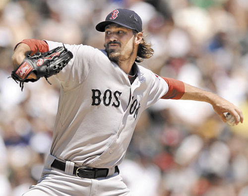 GOOD OUTING: Boston Red Sox starter Andrew Miller delivers a pitch against the Chicago White Sox during the first inning Sunday in Chicago. Miller went 52⁄3 innings, allowing three runs on 10 hits, striking out eight and walking one.