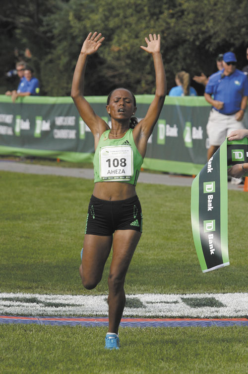 MADE IT: Aheza Kiros of Ethiopia crosses the finish line Saturday to win the 14th annual TD Bank Beach To Beacon 10K in Cape Elizabeth. Kiros finished in 32 minutes, 8.3 seconds.