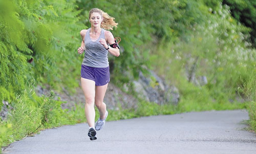 GETTING READY: Lauren LaRochelle runs on the Kennebec River Rail Trail on Wednesday in Hallowell. LaRochelle will be running in the Beach to Beacon 10K on Saturday.