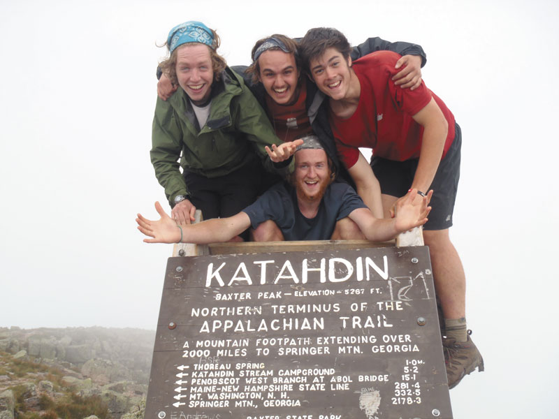 WE MADE IT: From top l-r, Jim McCullum, Nate Pronovost, Damian Melnicove and Austin Langsdorf, bottom center, celebrate the recent completion of their trek along the Appalachian Trail at the peak of Mt. Katahdin.