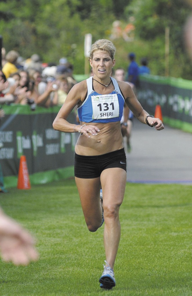 TOUGH RACE: Sheri Piers crosses the finish line to win her second Maine women’s title at the Beach to Beacon 10K Saturday in Cape Elizabeth.