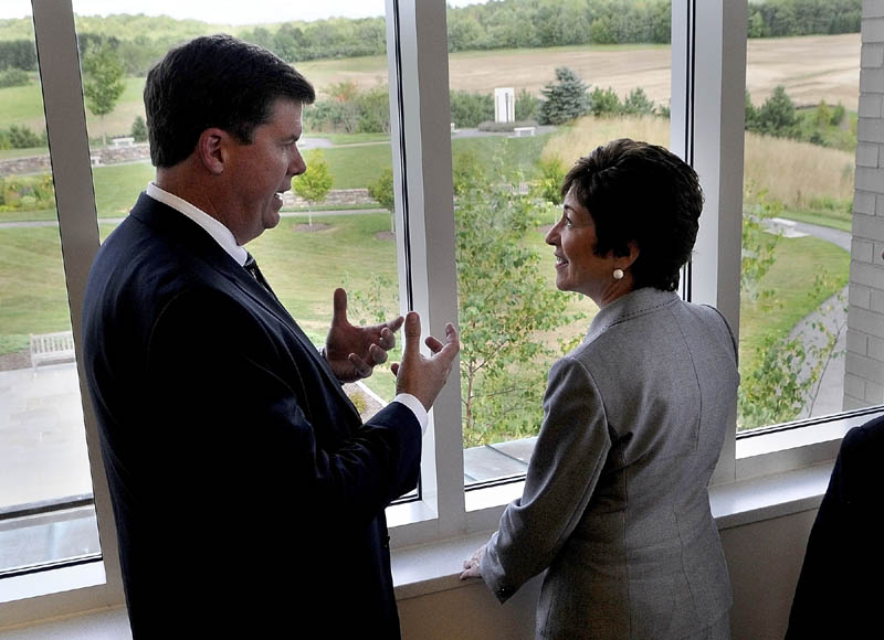 Maine General Medical Center Chief Executive Officer Chuck Hays, left, talks to U.S. Sen. Susan Collins, R-Maine, about construction of the new regional hospital being built outside the windows of the Harold Alfond Center for Cancer Care on Friday in Augusta. Sen. Collins had earlier announced federal funding for work on exit 113.