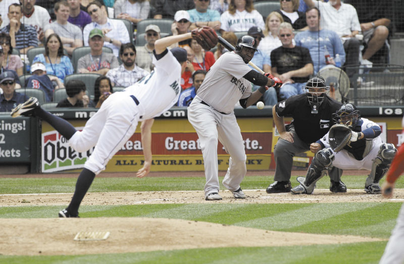 NICE WORK: Boston’s David Ortiz hits a single off Seattle Mariners starting pitcher Charlie Furbush in the fourth inning Sunday in Seattle. Furbush pitched seven innings, allowing one run on four hits, while striking out six and walking two in the Mariners’ 5-3 win.