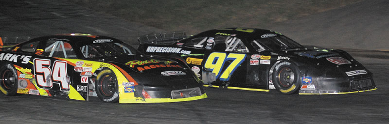MAKING HIS MOVE: Johnny Clark (54) makes a move to pass Joey Polewarcyzk during the Pro All Stars Series 150 at Seekonk Speedway on Saturday in Seekonk, Mass. Clark won the race, picking up his fifth victory of the season.