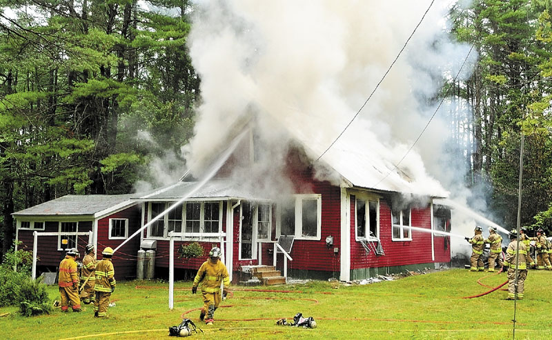 ADDED DIFFICULTY: The metal roof on this Wings Mills Road home in Mount Vernon made it difficult for firefighters to vent the smoke and heat, which complicated efforts to extinguish the blaze, Mount Vernon Deputy Fire Chief Tony Dunn said Tuesday.