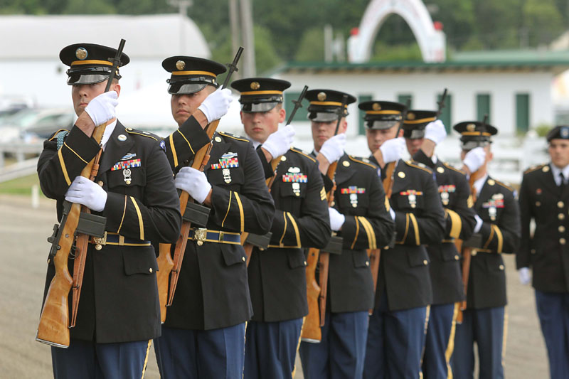 Members of a U.S. Army National Guard rifle squad take part in the Tribute to the Troops at the Skowhegan State Fair on Thursday.