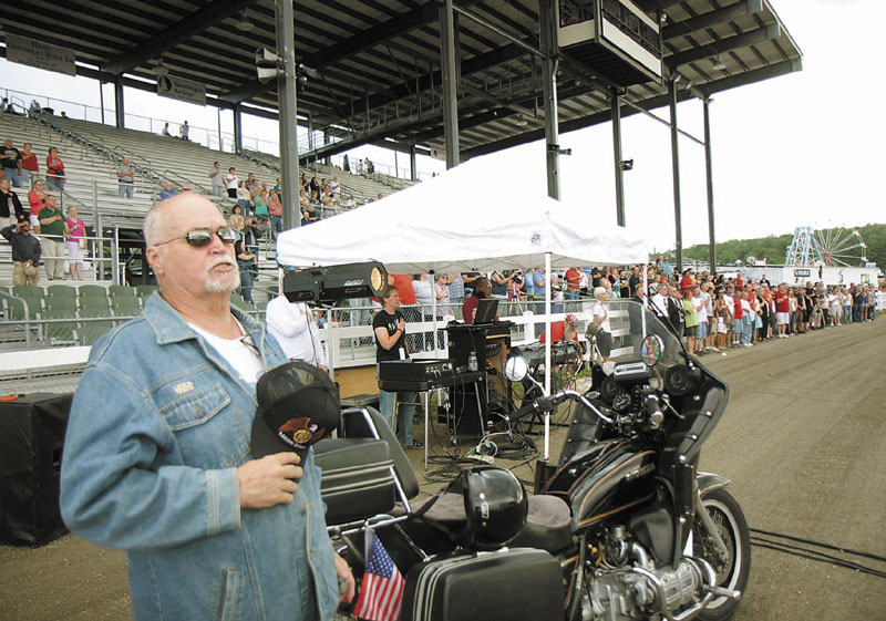 Ken Ingalls of Embden with the American Legion Riders Post 39 recites the Pledge of Allegiance during the Tribute to the Troops at the Skowhegan State Fair on Thursday.