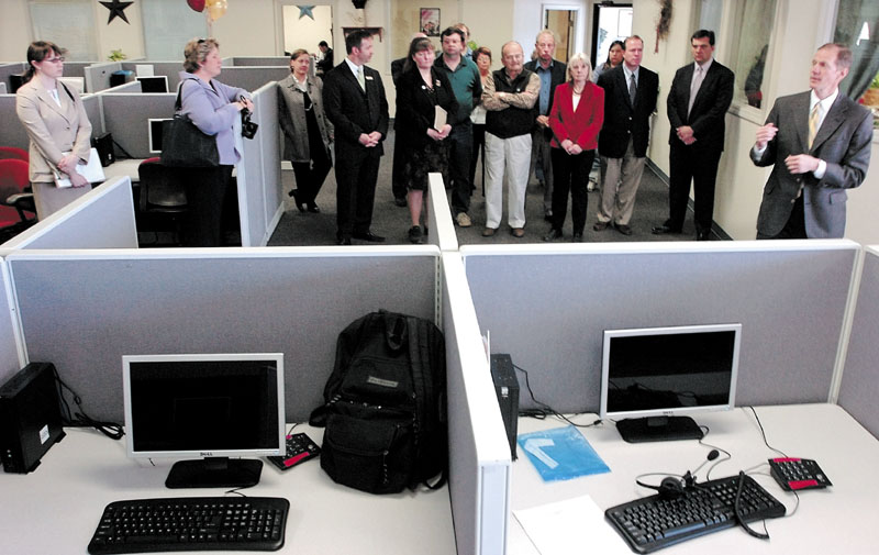 IN THE BEGINNING: Global Contact Services President and Chief Executive Officer Greg Alcorn gives a tour of the new call center during a 2008 grand opening at the Somerset Plaza in Pittsfield. The company closed the center last week.