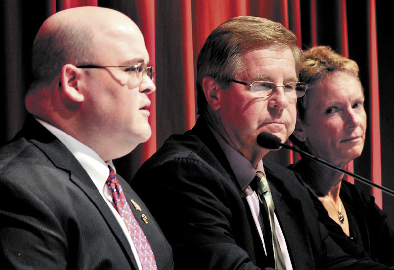 DEBATING: Waterville mayoral candidates Andrew Roy, left, Dana Sennett, center, and Karen Heck participate in a forum Monday at Thomas College in Waterville.