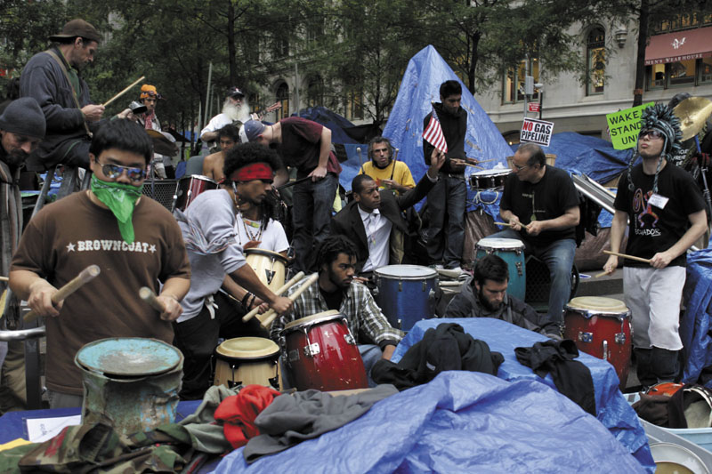 PEACEFUL: Occupy Wall Street protesters play drums and other percussion instruments at Zuccotti Park in New York on Wednesday.