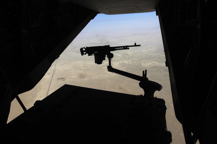 A machine gun is attached to the tail ramp of a U.S. military Osprey helicopter flying a mission in Helmand province, southern Afghanistan, recently.