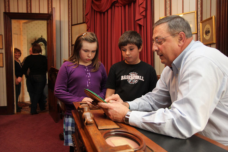 During a food drive at the Blaine House in Augusta on Saturday, Gov. Paul LePage showed William Harvey, 7, of Winslow and his nine-year-old sister Lilly a note written by President Abraham Lincoln to Speaker of the House James G. Blaine that was penned a week before Lincoln was assassinated. LePage and his wife, Ann, opened the Blaine House to guests as part of a food drive to help needy Mainers. The drive will occur again the next two Saturdays from 11 a.m. to 2 p.m. Guests can drop off non-perishable food items and chat with Maine's first family.