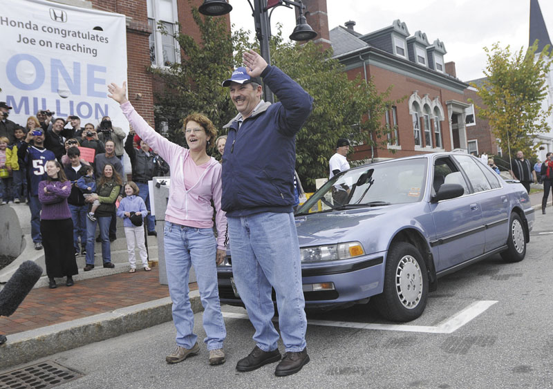Joe LoCicero and his wife Sharon wave to the crowd Sunday that gathered for a surprise parade on Main St. in Saco put on by Honda in honor of Joe for driving his 1990 Honda Accord over 1 million miles. Behind the LoCicero’s is the 1990 Honda Accord.