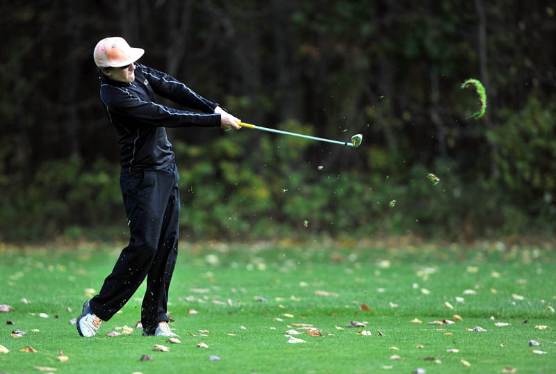 Luke Ruffing of Maranacook High School swings for the green on the 1st hole Saurday on the Tomahawk course at Natanis Golf Course in Vassalboro.