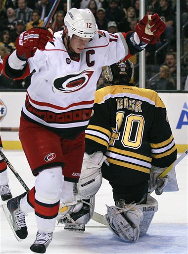 Carolina Hurricanes center Eric Staal (12) celebrates his goal against Boston Bruins goalie Tuukka Rask (40) of Finland in the third period of an NHL hockey game Tuesday in Boston.