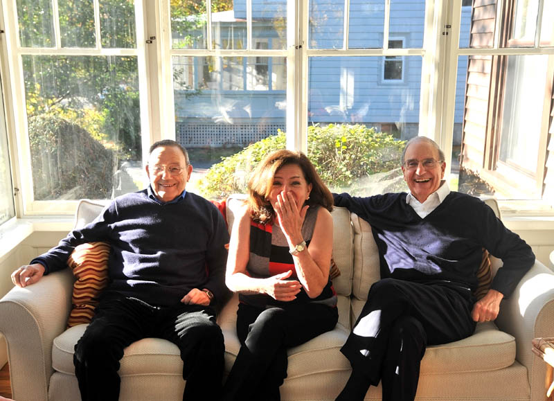 FEELING RIGHT AT HOME: Sen. George Mitchell, right, has a light moment with his sister, Barbara Atkins, and brother Paul Mitchell at Atkins’ Waterville residence on Friday.