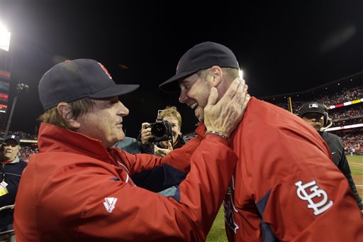 St. Louis Cardinals manager Tony La Russa, left, celebrates with starting pitcher Chris Carpenter after Carpenter pitched a three-hit shutout in Game 5 of the NLDS Friday in Philadelphia. The Cardinals beat the Phillies 1-0 to win the series 3-2.