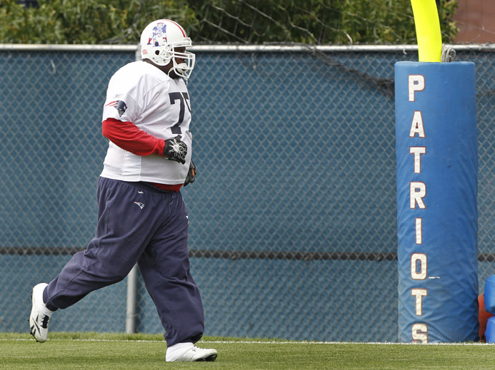 New England Patriots nose tackle Vince Wilfork runs to the end zone during NFL football practice in Foxborough, Mass., on Wednesday. "There's some things that we can change and some things we can play differently that allows us to be a better defense," he says. "I think everybody's striving for it."