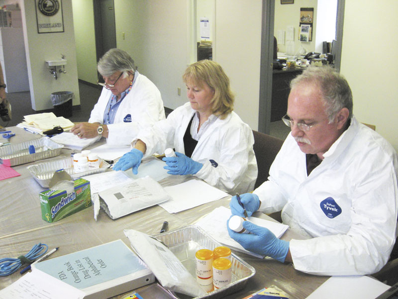 From left, project pharmacist volunteers Bill Miller, Kerry Kenney and Milton Stein inventory returns in 2009 at an undisclosed location. A team of state officials is about to test a potentially simple and cheap alternative to disposal of much of the state’s unused drugs: Composting.