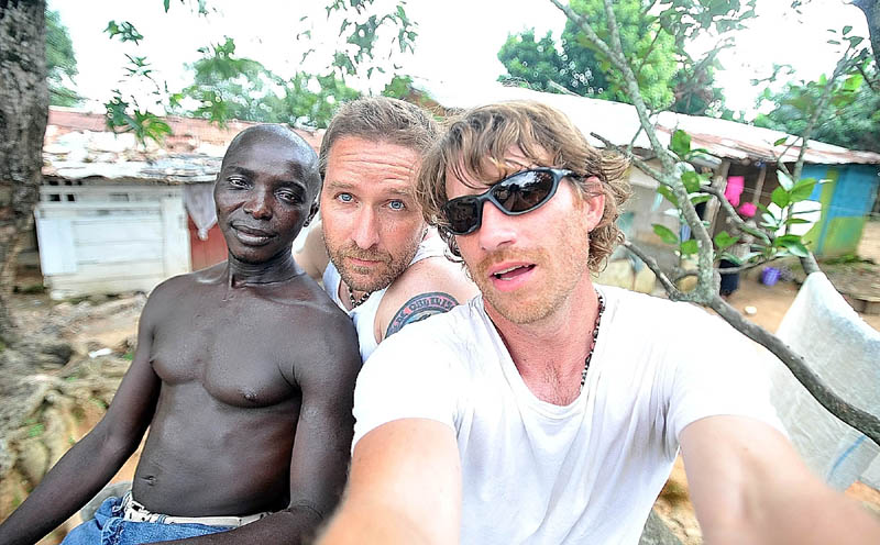 Jango, local fixer, at left, Greg Campbell, center, and Michael Seamans in Koidu City in eastern Sierra Leone near the Guinea border. Koidu is a major diamond trading center and the former center of the rebel army during the decade-long civil war that ended in 2002.