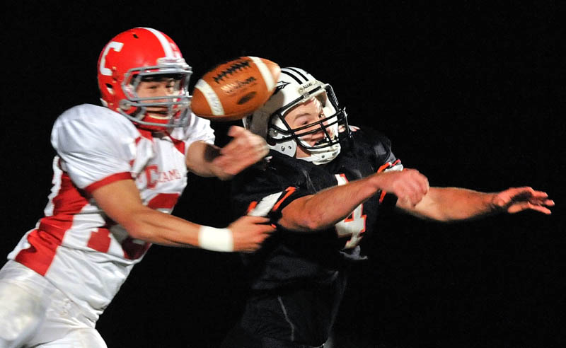 Skowhegan High School defender, Ethan Johnson, right, breaks up a pass to Cony High School receiver Chase Shostak in the end zone during the first quarter Friday night in Skowhegan.