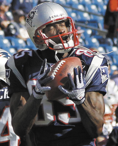 SLOW START: New England Patriots wide receiver Chad Ochocinco catches a pass during warm-ups prior to a game against the San Diego Chargers last month in Foxborough, Mass. Ochocinco has just nine catches for 136 yards this season.