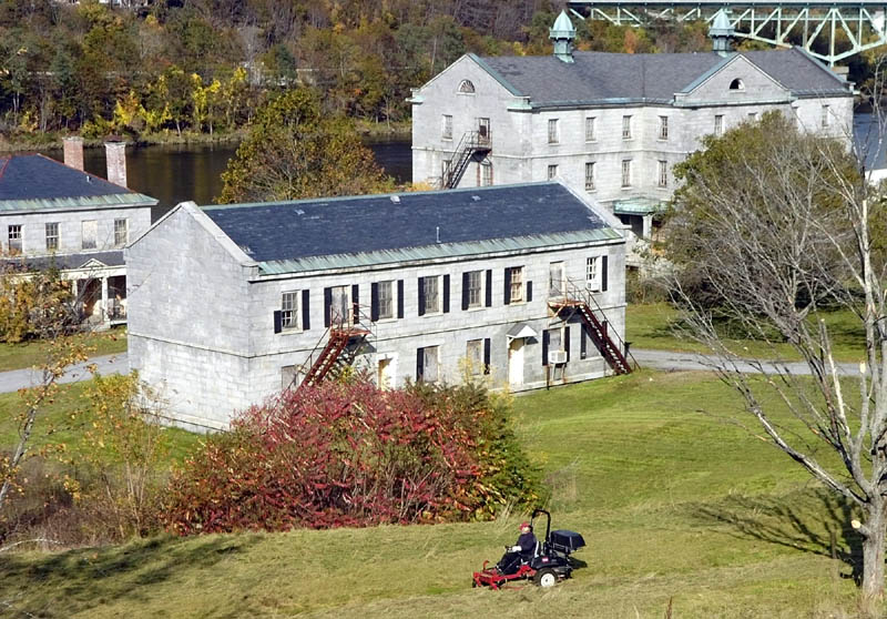 A lawnmower cuts the grass at the Kennebec Arsenal this week in Augusta.
