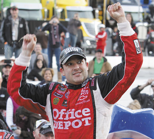 ANOTHER WIN: Tony Stewart celebrates his win in the NASCAR Sprint Cup Series race Sunday at Martinsville Speedway in Martinsville, Va. Stewart is now second in the points standings.