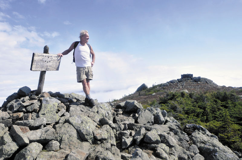 TAKING IN THE VIEW: John Christie enjoys the view from Avery Peak on Bigelow Mountain on Monday, Oct. 3. This was Christie’s 27th consecutive year hiking the mountain.
