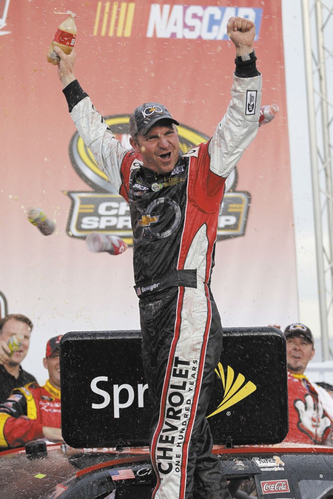 LET’S GET CRAZY: Clint Bowyer celebrates in victory lane after winning the Good Sam Club 500 Sunday at Talladega Speedway in Talladega, Ala.