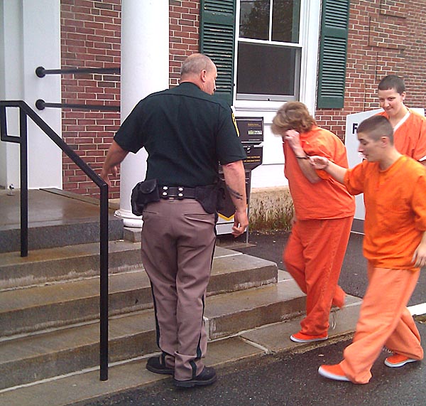 Carol Field is escorted into the courthouse in York County this morning.