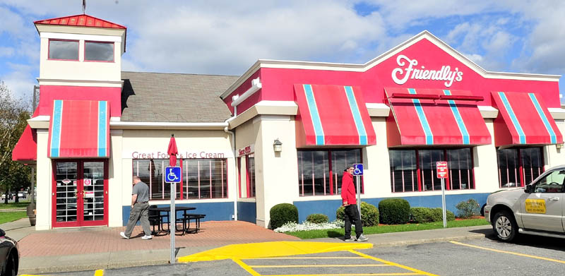 Customers walk outside the Friendly's restaurant on Upper Main Street in Waterville on Wednesday. The store, along with the one in Augusta, is not one of the 63 stores nationwide that will close.