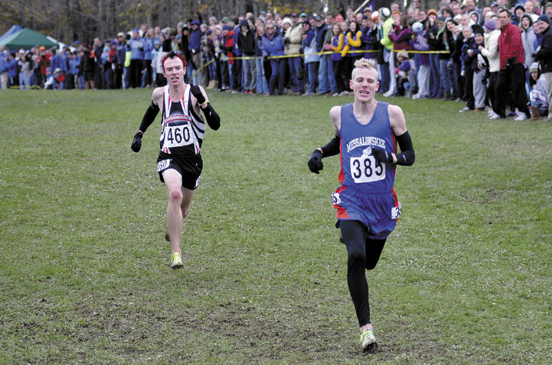 PHOTO FINISH: Scarborough’s Nick Morris gains ground in the final stretch on Messalonskee’s Harlow Ladd at the end of the Class A cross country state championships Saturday at Twin Brook Recreation Area in Cumberland. Morris caught Ladd and won a photo finish.