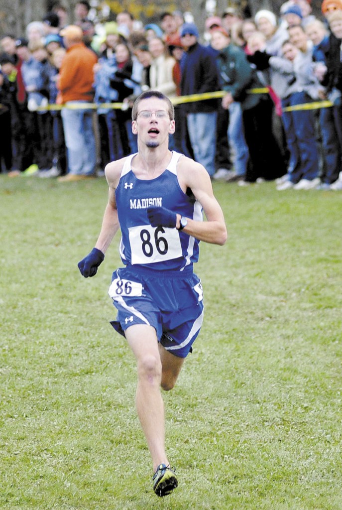 WINNER: Madison’s Matthew McClintock races to the finish line during the Class C state cross country championships Saturday at Twin Brook Recreation Area in Cumberland. McClintock won the title in 15:52.91.