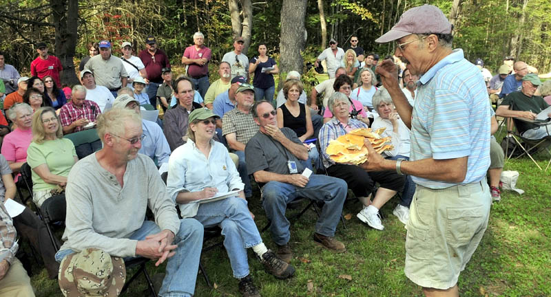 TASTES LIKE CHICKEN? Richard Tory of Canaan talks about chicken mushrooms he collected during a mushroom workshop Sunday at the Quarry Road Recreation Area in Waterville.