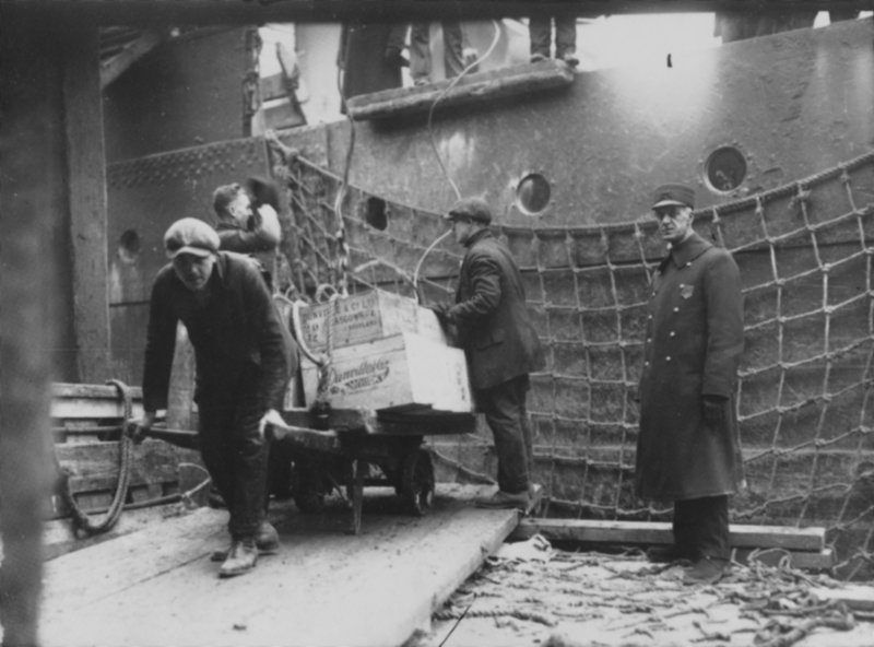 Press Herald file photo Officials remove illegal liquor from a ship docked at the Grand Trunk Wharf in Portland Harbor in the 1920s. Prohibition became law nationwide with the 18th Amendment in 1919.